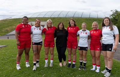 150725 - Wales Women Women’s Rugby World Cup 2025 Kit Launch, National Botanical Gardens of Wales - Jersey designer Brogan Evans, centre with Wales players Sisilia Tuipulotu, Georgia Evans, Alex Callender, Kate Williams, Keira Bevan, Molly Reardonand Maisie Davies at the launch of the Wales Women’s Rugby World Cup kit at the National Botanical Gardens of Wales