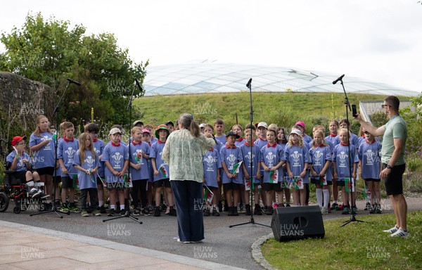 150725 - Wales Women Women’s Rugby World Cup 2025 Kit Launch, National Botanical Gardens of Wales - Schoolchildren sing at the kit launch