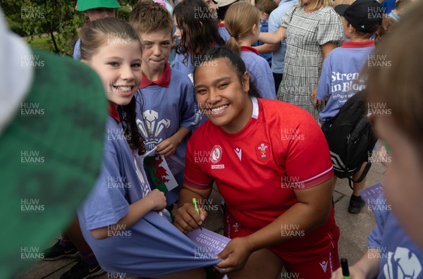150725 - Wales Women Women’s Rugby World Cup 2025 Kit Launch, National Botanical Gardens of Wales - Sisilia Tuipulotu with schoolchildren at the launch of the Wales Women’s Rugby World Cup kit at the National Botanical Gardens of Wales