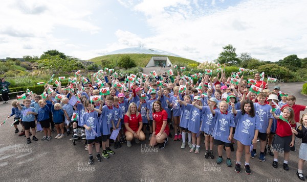 150725 - Wales Women Women’s Rugby World Cup 2025 Kit Launch, National Botanical Gardens of Wales - Wales players, join with schoolchildren at the launch of the Wales Women’s Rugby World Cup kit at the National Botanical Gardens of Wales