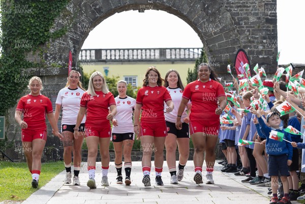 150725 - Wales Women Women’s Rugby World Cup 2025 Kit Launch, National Botanical Gardens of Wales - Wales players, left to right, Molly Reardon, Georgia Evans, Alex Callender, Keira Bevan, Kate Williams, Maisie Davies and Sisilia Tuipulotu at the launch of the Wales Women’s Rugby World Cup kit