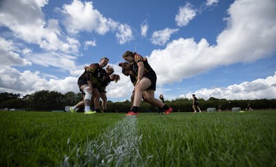 040925 - Wales Women RWC Rugby Training session - Wales warm up ahead of scrummaging during a rugby training session ahead of Wales’ final Women’s Rugby World Cup match against Fiji