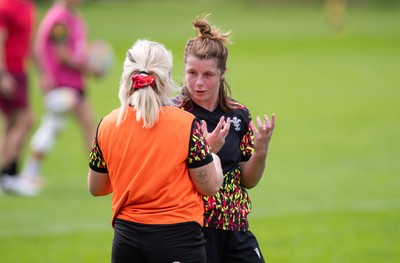040925 - Wales Women RWC Rugby Training session - Kate Williams with Alex Callender during a rugby training session ahead of Wales’ final Women’s Rugby World Cup match against Fiji