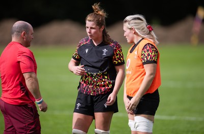040925 - Wales Women RWC Rugby Training session - Co-captains Kate Williams and Alex Callender with Sean Lynn, Wales Women head coach during a rugby training session ahead of Wales’ final Women’s Rugby World Cup match against Fiji