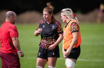 040925 - Wales Women RWC Rugby Training session - Co-captains Kate Williams and Alex Callender with Sean Lynn, Wales Women head coach during a rugby training session ahead of Wales’ final Women’s Rugby World Cup match against Fiji