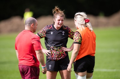 040925 - Wales Women RWC Rugby Training session - Co-captains Kate Williams and Alex Callender with Sean Lynn, Wales Women head coach during a rugby training session ahead of Wales’ final Women’s Rugby World Cup match against Fiji