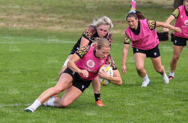 040925 - Wales Women RWC Rugby Training session - Carys Cox is held by Alex Callender during a rugby training session ahead of Wales’ final Women’s Rugby World Cup match against Fiji