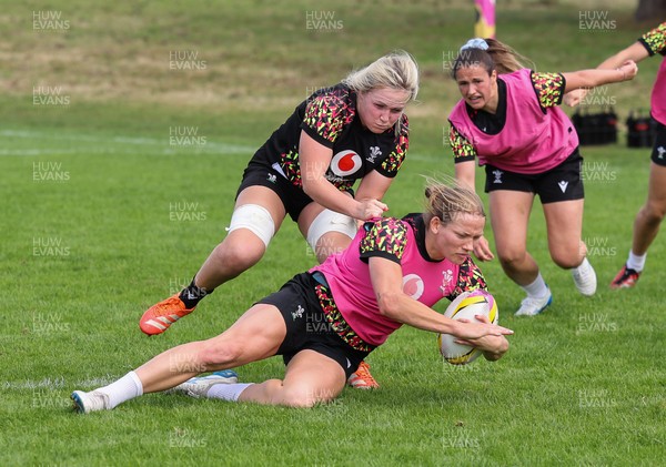 040925 - Wales Women RWC Rugby Training session - Carys Cox is held by Alex Callender during a rugby training session ahead of Wales’ final Women’s Rugby World Cup match against Fiji
