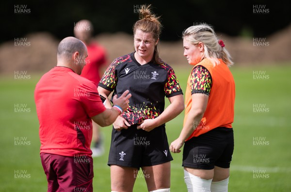 040925 - Wales Women RWC Rugby Training session - Co-captains Kate Williams and Alex Callender with Sean Lynn, Wales Women head coach during a rugby training session ahead of Wales’ final Women’s Rugby World Cup match against Fiji