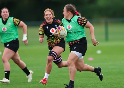 190825 - Wales Women Rugby World Cup Training Session - Carys Phillips with Georgia Evans and Katherine Baverstock in support during a Wales training session ahead of their first Women’s Rugby World Cup match against Scotland