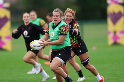 190825 - Wales Women Rugby World Cup Training Session - Carys Phillips is caught by Georgia Evans during a Wales training session ahead of their first Women’s Rugby World Cup match against Scotland