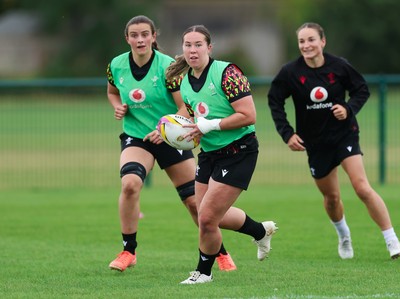 190825 - Wales Women Rugby World Cup Training Session - Katherine Baverstock with Branwen Metcalfe and Jasmine Joyce in support during a Wales training session ahead of their first Women’s Rugby World Cup match against Scotland