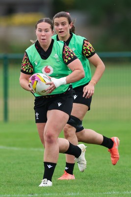 190825 - Wales Women Rugby World Cup Training Session - Katherine Baverstock with Branwen Metcalfe in support during a Wales training session ahead of their first Women’s Rugby World Cup match against Scotland