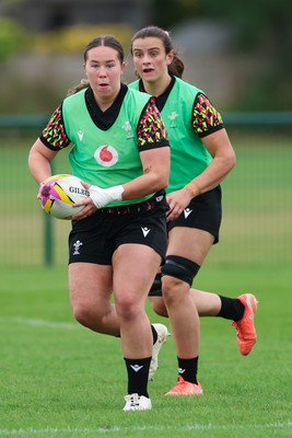 190825 - Wales Women Rugby World Cup Training Session - Katherine Baverstock with Branwen Metcalfe in support during a Wales training session ahead of their first Women’s Rugby World Cup match against Scotland