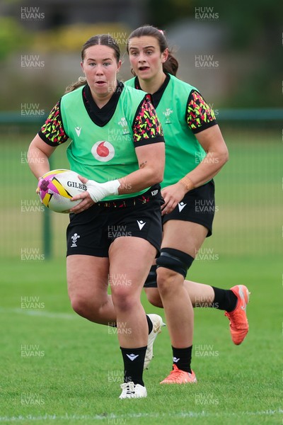 190825 - Wales Women Rugby World Cup Training Session - Katherine Baverstock with Branwen Metcalfe in support during a Wales training session ahead of their first Women’s Rugby World Cup match against Scotland