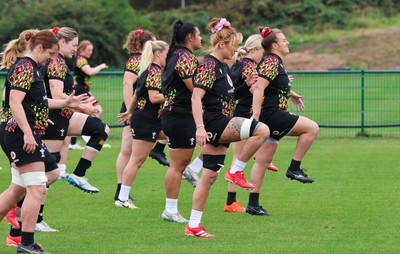 210825 - Wales Women Rugby World Cup Training Session - The team warm up during a Wales training session ahead of their first Women’s Rugby World Cup match against Scotland