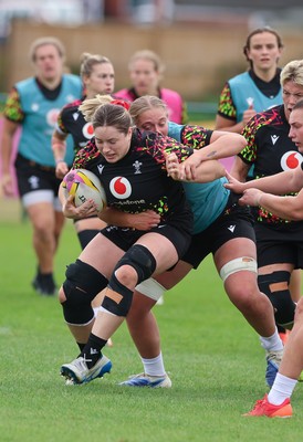 210825 - Wales Women Rugby World Cup Training Session - Gwen Crabb is tackled by Tilly Vucaj during a Wales training session ahead of their first Women’s Rugby World Cup match against Scotland