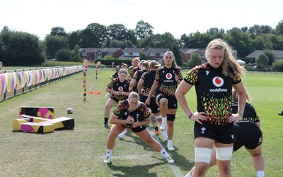 250825 - Wales Women Rugby World Cup Training Session - The team warm up during a Wales training session ahead of their Women’s Rugby World Cup match against Canada