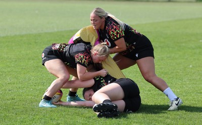 250825 - Wales Women Rugby World Cup Training Session - Kelsey Jones, Seren Lockwood and Maisie Davies during a Wales training session ahead of their Women’s Rugby World Cup match against Canada