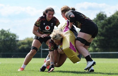 250825 - Wales Women Rugby World Cup Training Session - Branwen Metcalfe, Kerin Lake and Abbie Fleming during a Wales training session ahead of their Women’s Rugby World Cup match against Canada