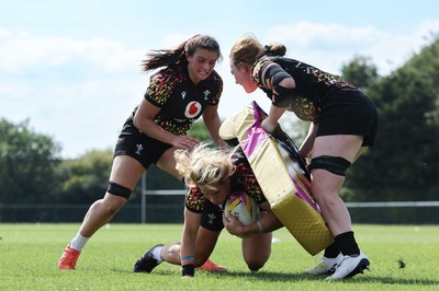 250825 - Wales Women Rugby World Cup Training Session - Branwen Metcalfe, Kerin Lake and Abbie Fleming during a Wales training session ahead of their Women’s Rugby World Cup match against Canada