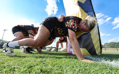 250825 - Wales Women Rugby World Cup Training Session - Kelsey Jones goes through some scrummaging during a Wales training session ahead of their Women’s Rugby World Cup match against Canada