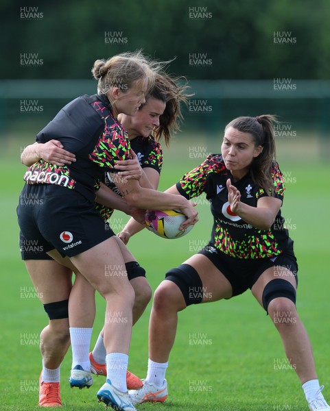 250825 - Wales Women Rugby World Cup Training Session - Carys Cox, Branwen Metcalfe and Bryonie King during a Wales training session ahead of their Women’s Rugby World Cup match against Canada