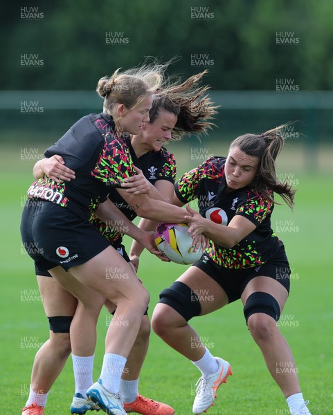 250825 - Wales Women Rugby World Cup Training Session - Carys Cox, Branwen Metcalfe and Bryonie King during a Wales training session ahead of their Women’s Rugby World Cup match against Canada