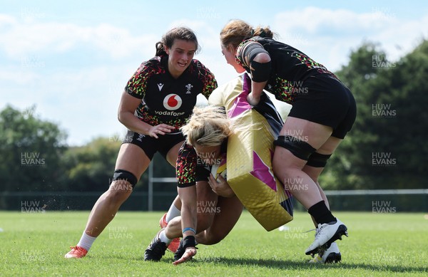 250825 - Wales Women Rugby World Cup Training Session - Branwen Metcalfe, Kerin Lake and Abbie Fleming during a Wales training session ahead of their Women’s Rugby World Cup match against Canada