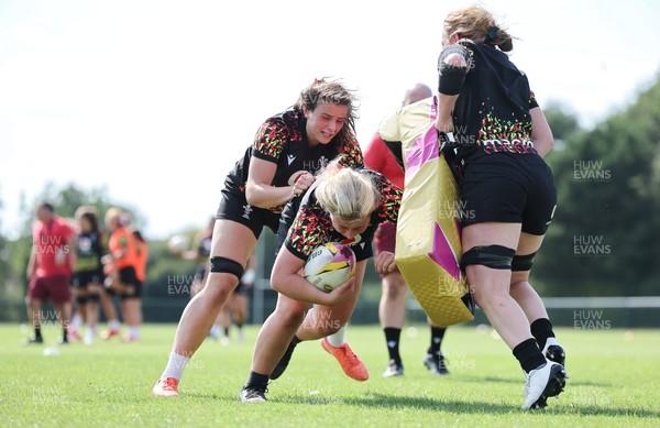 250825 - Wales Women Rugby World Cup Training Session - Branwen Metcalfe, Molly Reardon and Abbie Fleming during a Wales training session ahead of their Women’s Rugby World Cup match against Canada