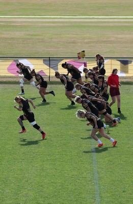 280825 - Wales Women Rugby World Cup Training Session - The squad warm up during a Wales rugby training session ahead of their Women’s Rugby World Cup match against Canada