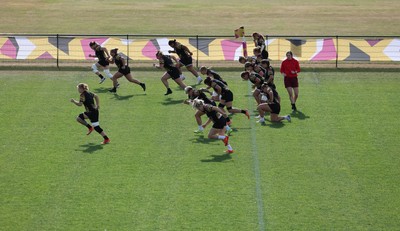 280825 - Wales Women Rugby World Cup Training Session - The squad warm up during a Wales rugby training session ahead of their Women’s Rugby World Cup match against Canada