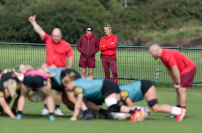 280825 - Wales Women Rugby World Cup Training Session - Dr Gwennan Williams, Wales Women team doctor and Jo Perkins, physio, look on during a Wales rugby training session ahead of their Women’s Rugby World Cup match against Canada