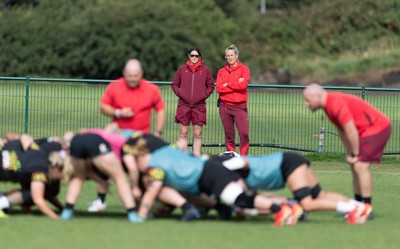 280825 - Wales Women Rugby World Cup Training Session - Dr Gwennan Williams, Wales Women team doctor and Jo Perkins, physio, look on during a Wales rugby training session ahead of their Women’s Rugby World Cup match against Canada