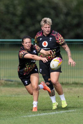 280825 - Wales Women Rugby World Cup Training Session - Meg Davies with Donna Rose during a Wales rugby training session ahead of their Women’s Rugby World Cup match against Canada