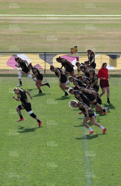 280825 - Wales Women Rugby World Cup Training Session - The squad warm up during a Wales rugby training session ahead of their Women’s Rugby World Cup match against Canada