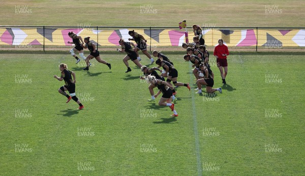 280825 - Wales Women Rugby World Cup Training Session - The squad warm up during a Wales rugby training session ahead of their Women’s Rugby World Cup match against Canada