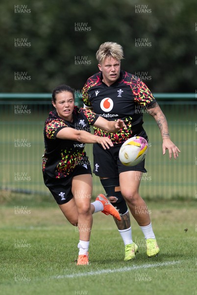 280825 - Wales Women Rugby World Cup Training Session - Meg Davies with Donna Rose during a Wales rugby training session ahead of their Women’s Rugby World Cup match against Canada