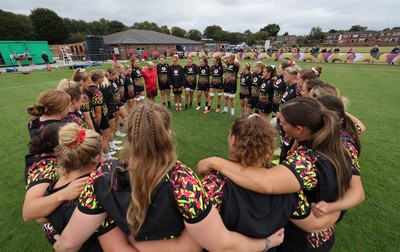 180825 - Wales Women Training Session - The team huddle up during a Wales Women training session ahead of their first Women’s Rugby World Cup match against Scotland