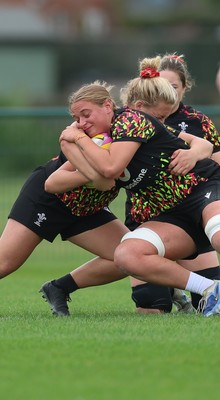 180825 - Wales Women Training Session - Tilly Vucaj is tackled by  Molly Reardon during a Wales Women training session ahead of their first Women’s Rugby World Cup match against Scotland