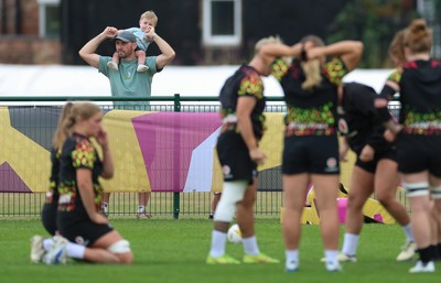 180825 - Wales Women Training Session - A young rugby supporter looks on during a Wales Women training session ahead of their first Women’s Rugby World Cup match against Scotland