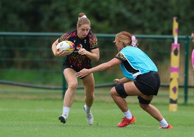 180825 - Wales Women Training Session - Lisa Neumann takes on Georgia Evans during a Wales Women training session ahead of their first Women’s Rugby World Cup match against Scotland