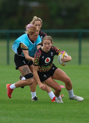 180825 - Wales Women Training Session - Carys Cox is held by Georgia Evans during a Wales Women training session ahead of their first Women’s Rugby World Cup match against Scotland