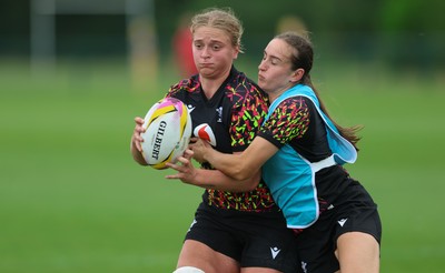 180825 - Wales Women Training Session - Tilly Vucaj  is tackled by Nel Metcalfe during a Wales Women training session ahead of their first Women’s Rugby World Cup match against Scotland