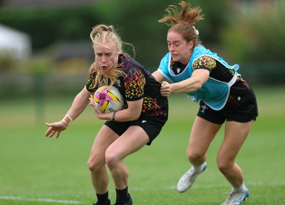 180825 - Wales Women Training Session - Cath Richards is held by Lisa Neumann during a Wales Women training session ahead of their first Women’s Rugby World Cup match against Scotland