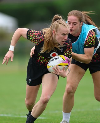 180825 - Wales Women Training Session - Cath Richards is held by Lisa Neumann during a Wales Women training session ahead of their first Women’s Rugby World Cup match against Scotland