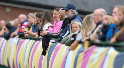 180825 - Wales Women Training Session - Rugby fans look on during a Wales Women training session ahead of their first Women’s Rugby World Cup match against Scotland
