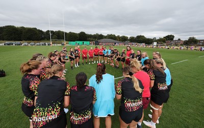 180825 - Wales Women Training Session - The team huddle up during a Wales Women training session ahead of their first Women’s Rugby World Cup match against Scotland