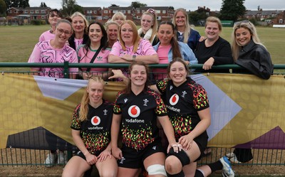 180825 - Wales Women Training Session - Wales’  Cath Richards, Kate Williams and Bethan Lewis with rugby fans who watched the Wales Women training session ahead of their first Women’s Rugby World Cup match against Scotland