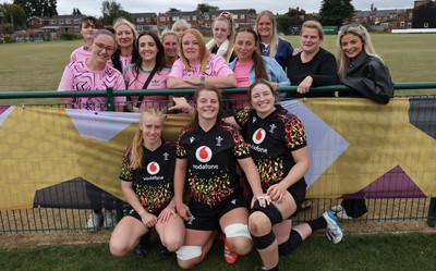 180825 - Wales Women Training Session - Wales’  Cath Richards, Kate Williams and Bethan Lewis with rugby fans who watched the Wales Women training session ahead of their first Women’s Rugby World Cup match against Scotland